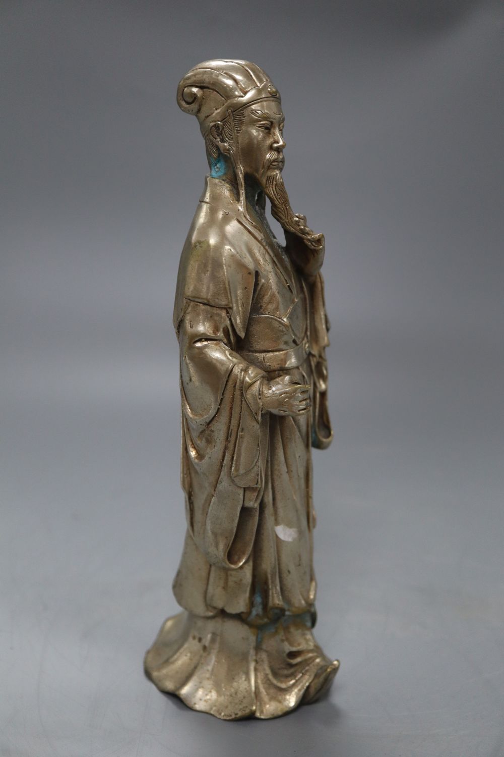A Chinese silvered metal figure of an elder, height 24cm